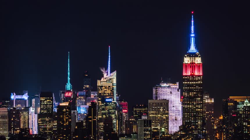 New York City skyscrapers illuminate the night sky