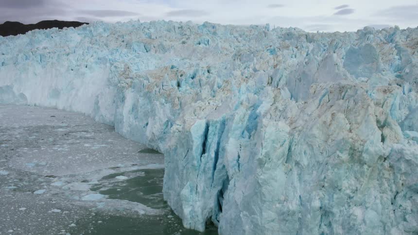 The large icebergs line in the water making a wall
