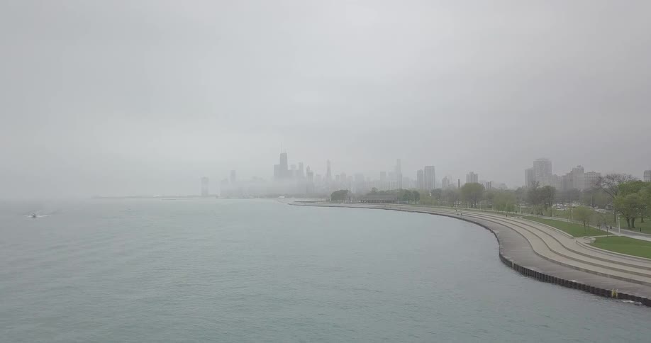 Fog covers a coastal city skyline