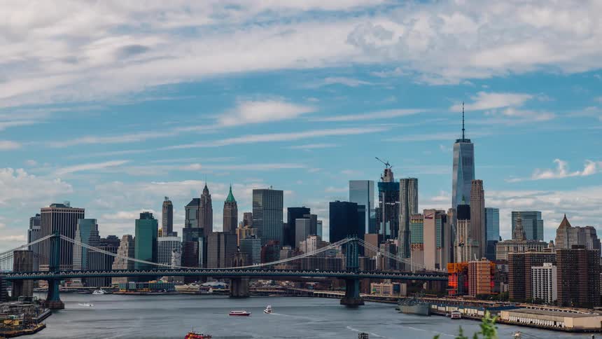 Boats and barges travel down the city waterway