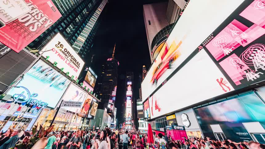 Pedestrians and tourists travel in times square
