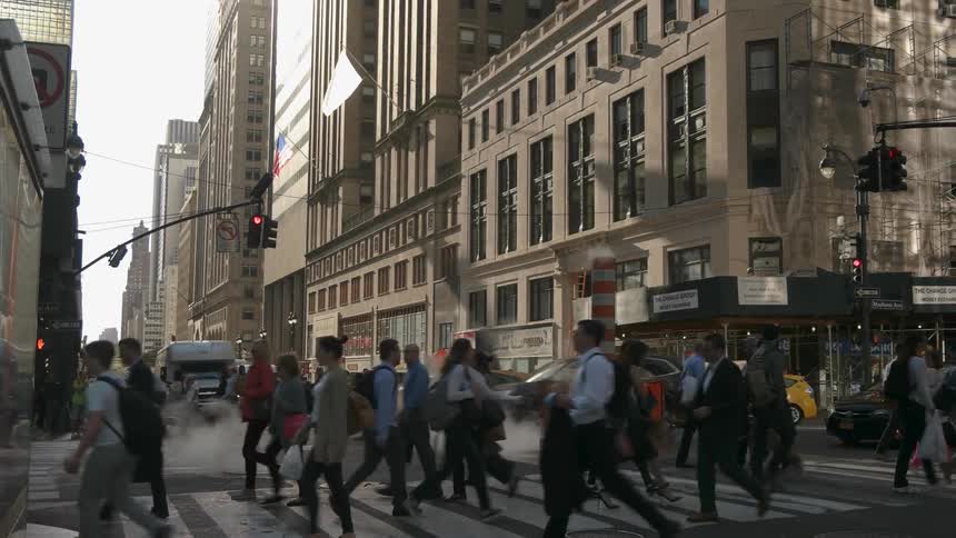 Pedestrians cross a city street