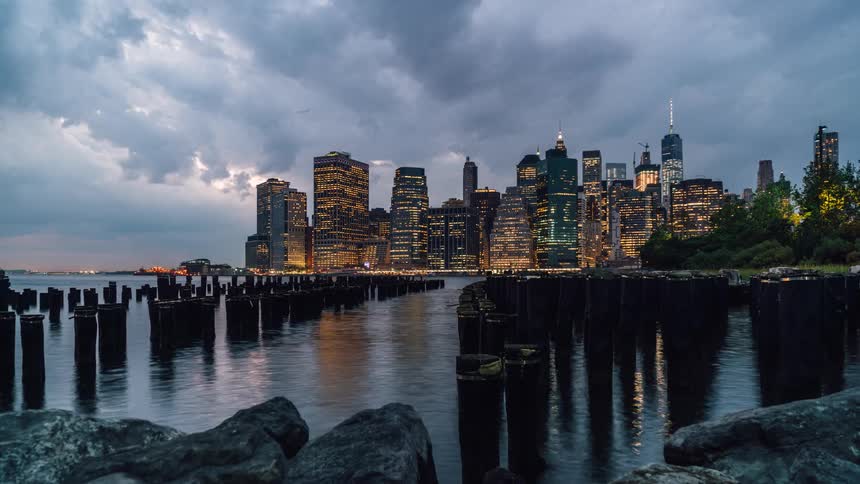 The sun begins to set over the city ahead