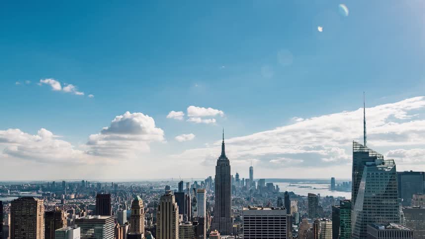 The city is full of tall towers on a cloudy day