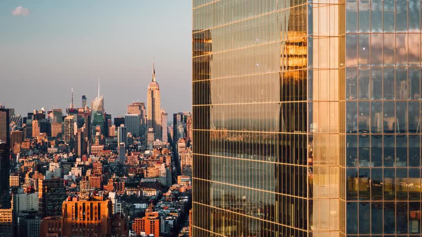 A skyscraper and city is being filmed in a time lapse