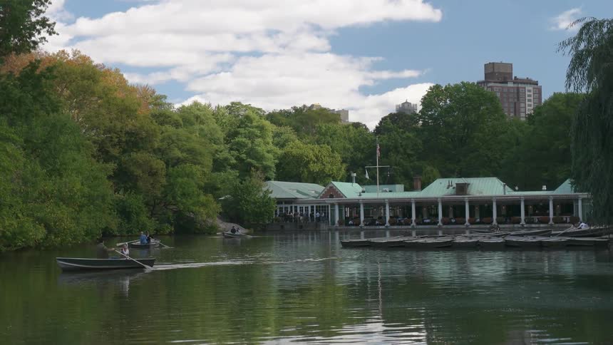 People paddle boats in a small lake