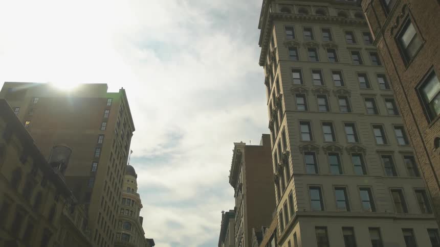 The sun is setting over the tall building