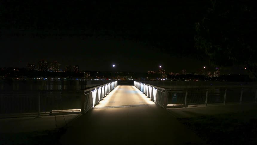 Small bridge lit up at night