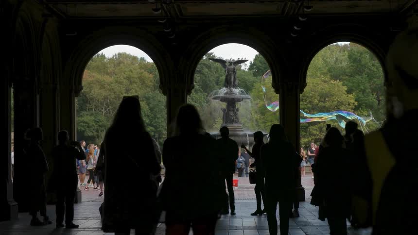 People walk through the archways