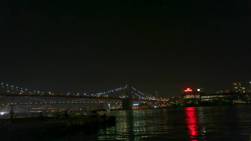 The bridge is brightly lit at night