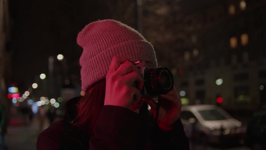 A woman is taking photographs