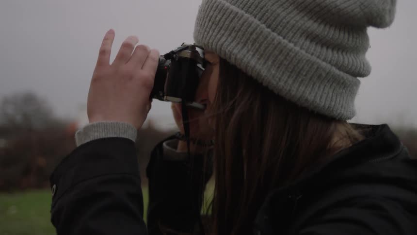 A woman is taking photographs