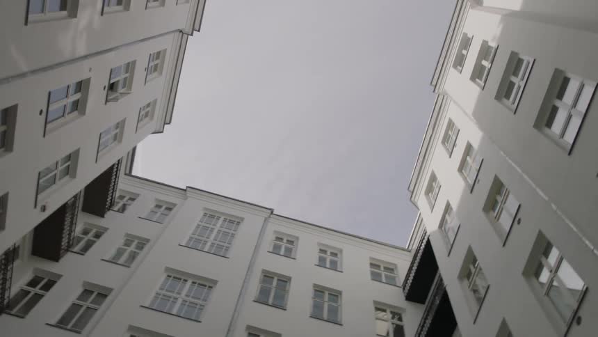 The building is connected in a square with many windows