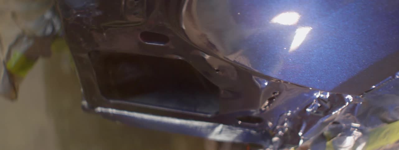 The car is slightly damaged with some dents