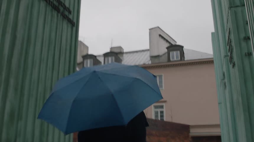 A woman walks up wet stairs
