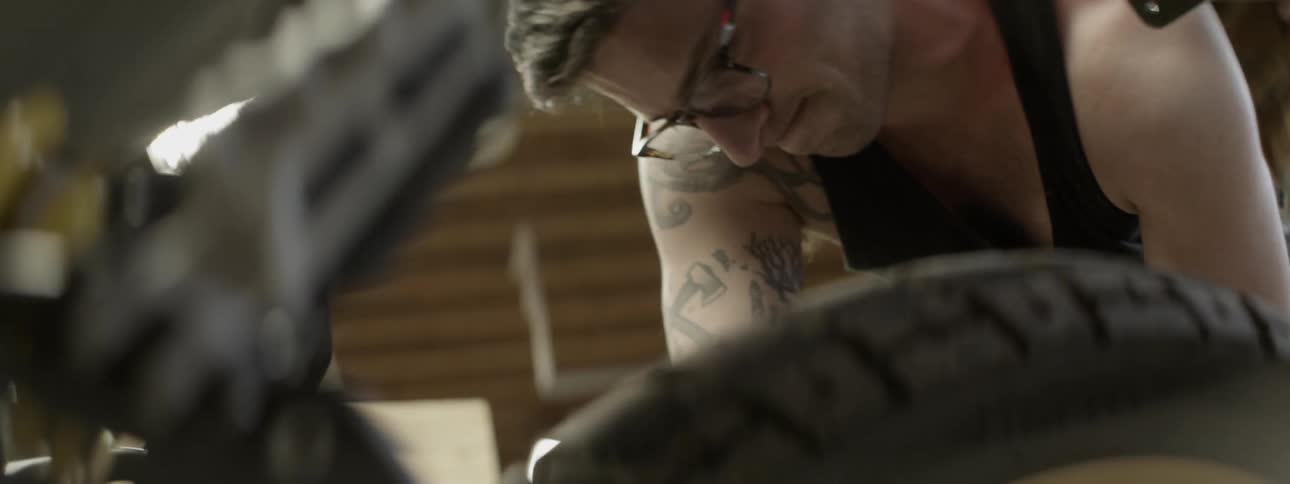 Man working on a vehicle in a garage