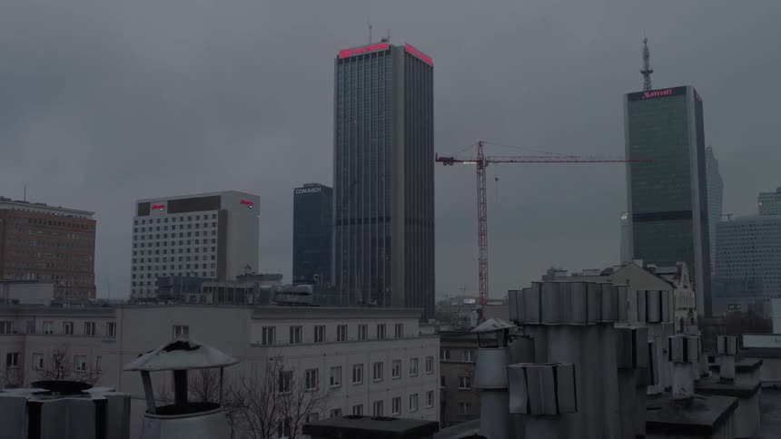 The city is full of tall buildings on a cloudy day