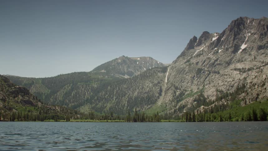 Water ripples on a mountain lake on a sunny day
