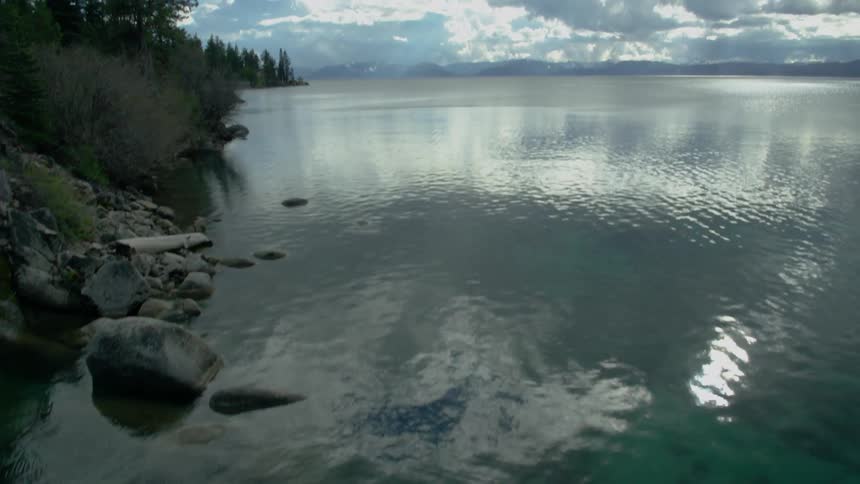 Blue water flows calmly in the lake