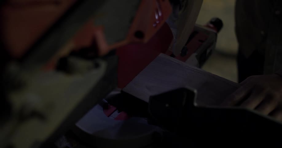 Machinery saws into a piece of metal