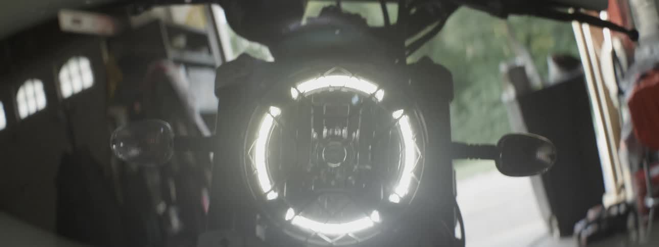 The motorcycle has a bright headlight