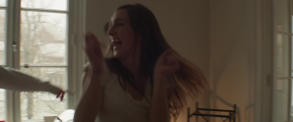 Women dance together at home