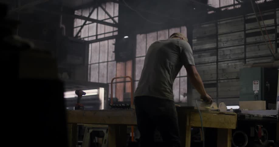 A man is working in a shop