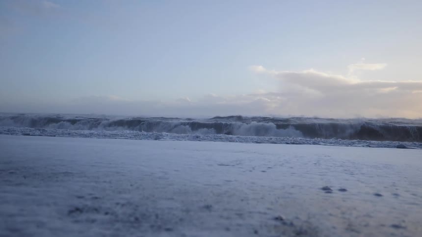 The field is full of ice and snow as the snow begins to melt