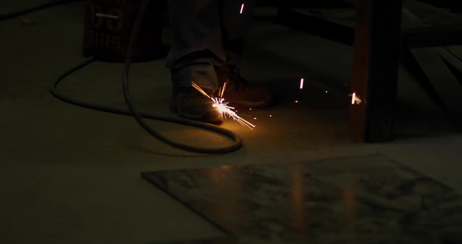 Sparks hit the floor of a workshop