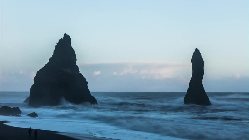 The waves move fast crashing against the coast