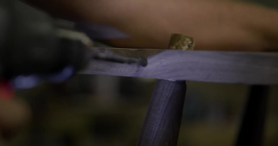 Wood is being drilled up close