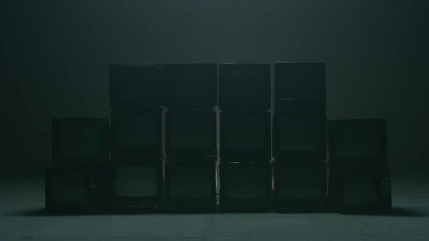 Old televisions stacked on top of each other
