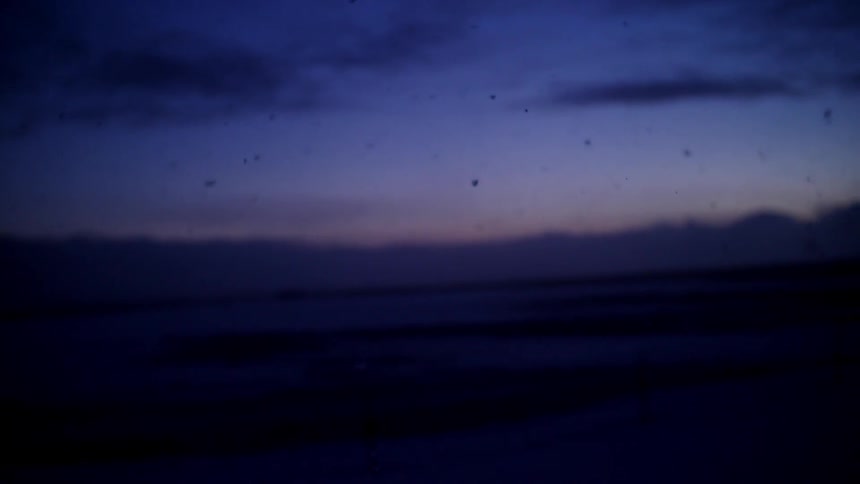 Snowflakes fall at dusk