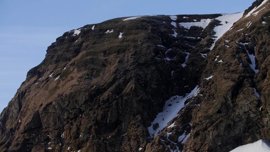 A snowy brown mountain