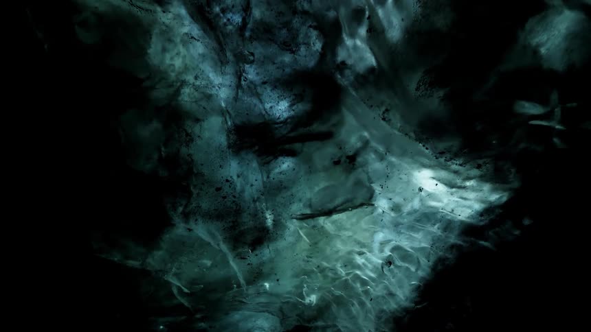 Under the ice it is black and clear at points
