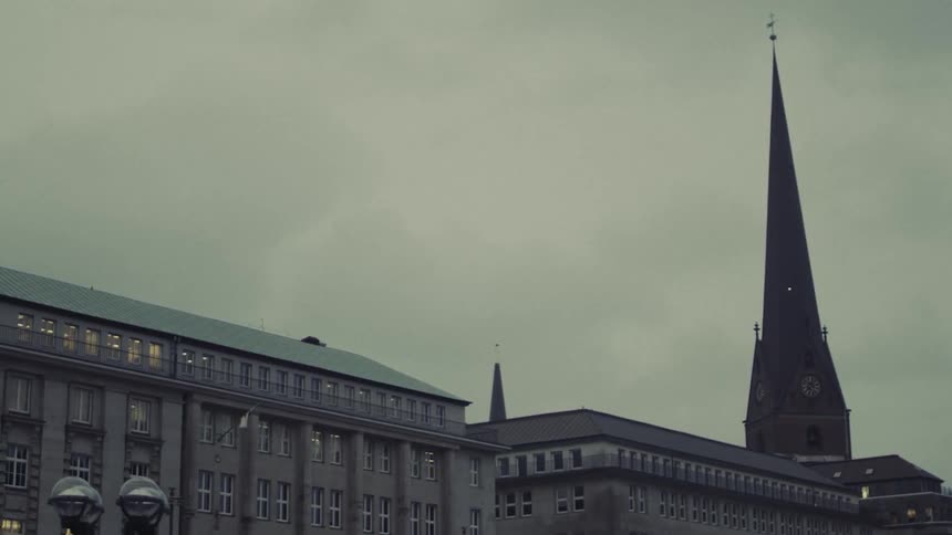 City buildings are shown on an overcast day
