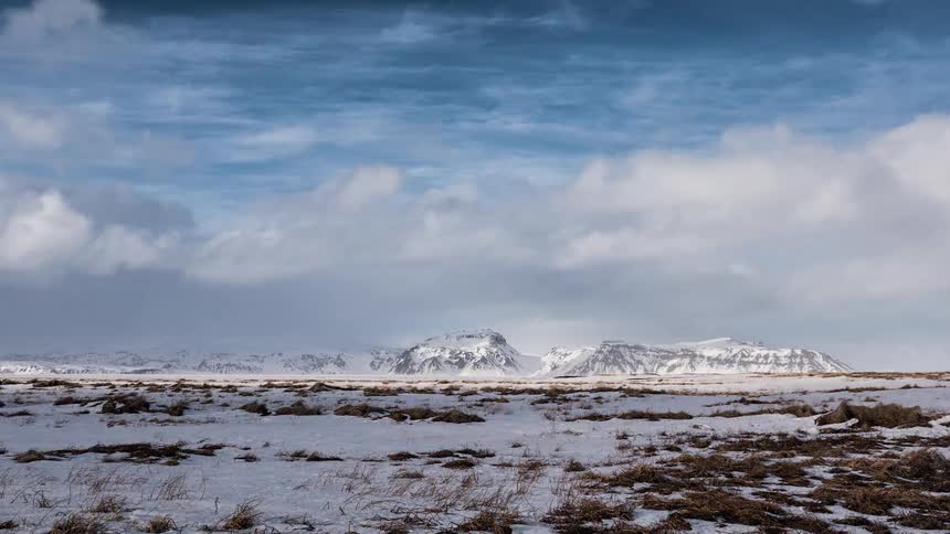 Clouds passing over a snowy wilderness