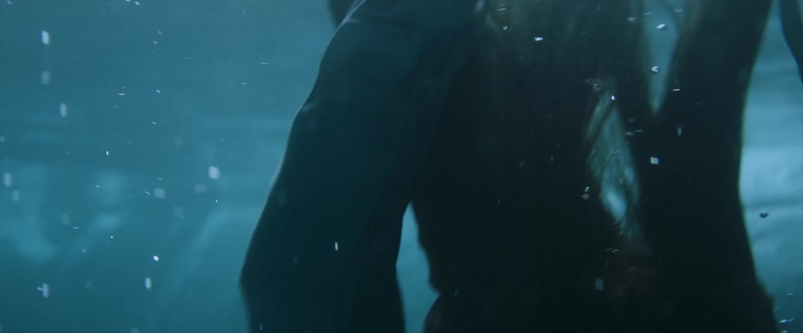 A person sinks into the water
