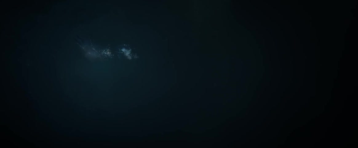 People swimming in dark water