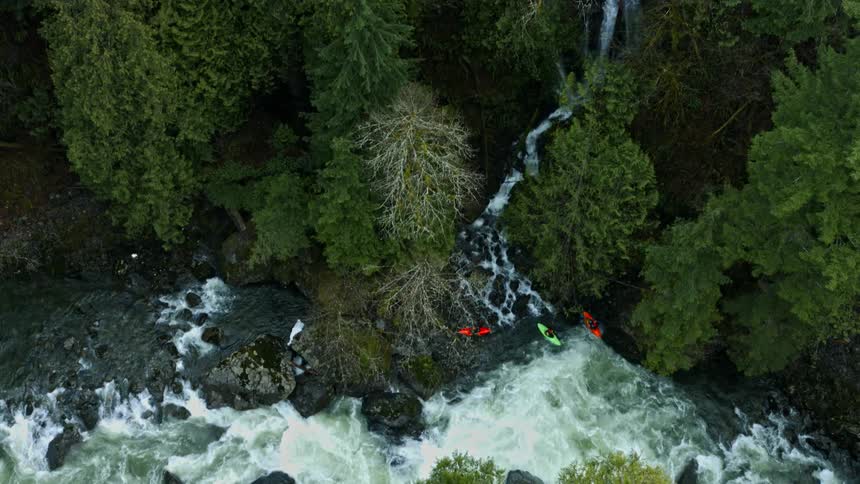 Water flows rapidly down a stream