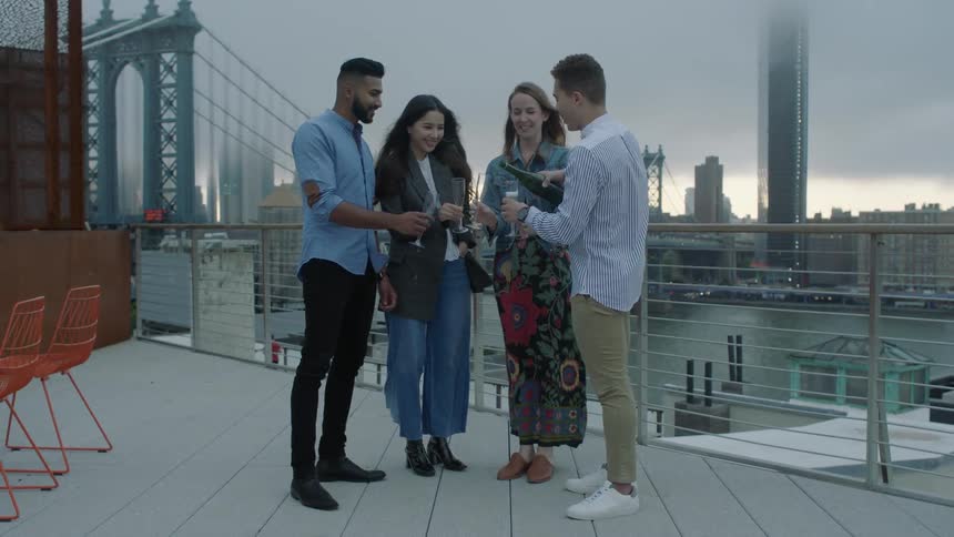 A group of people talk together on a roof