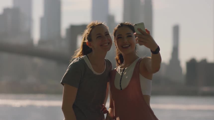 Two women joggers take a photo together