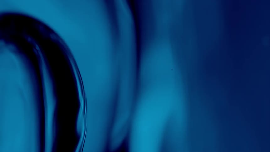 Blue liquid swirling