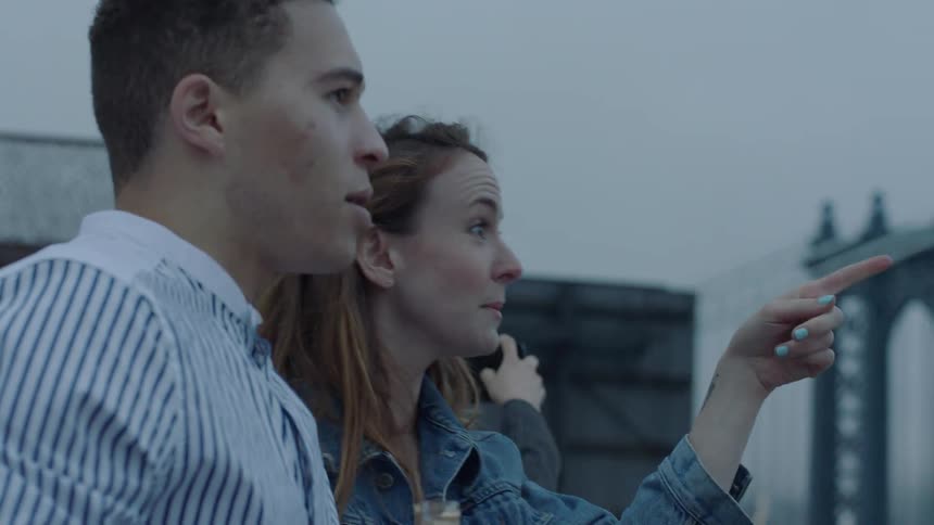 Man and woman standing outside talking