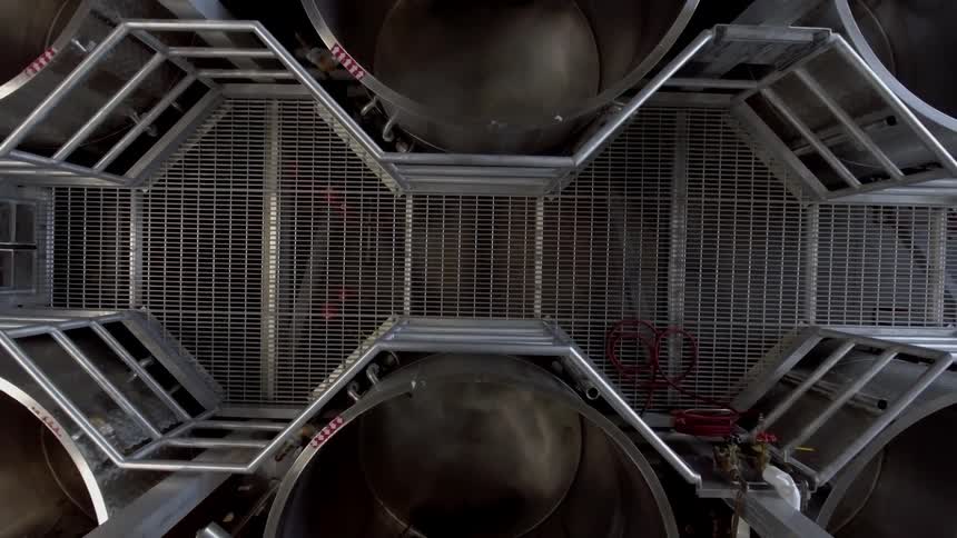 View of metal barrels in a factory