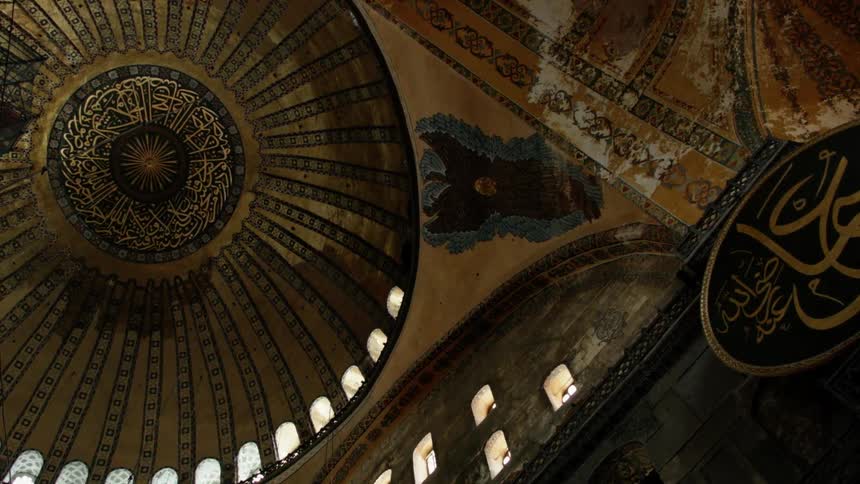 A church has a tall domed ceiling