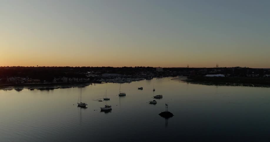 Sailboats travel along the waterway