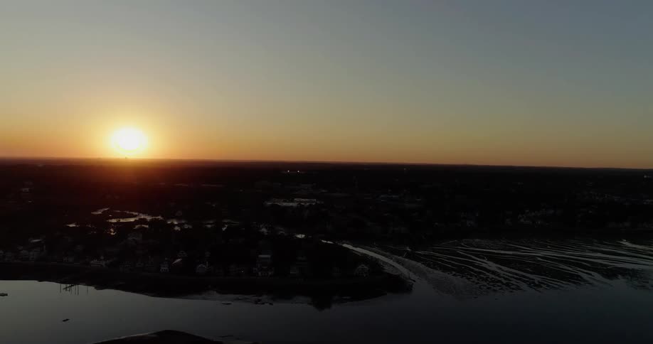 The sun shines brightly above the water