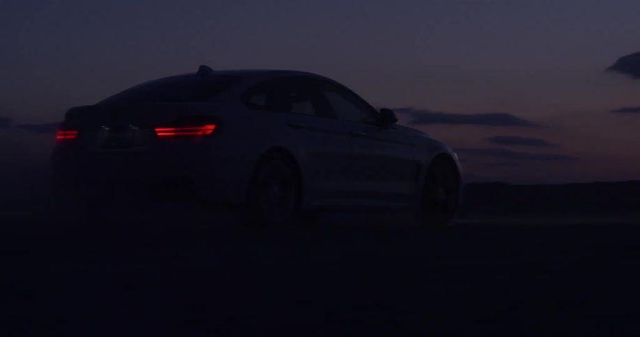 Car traveling outside at sunset