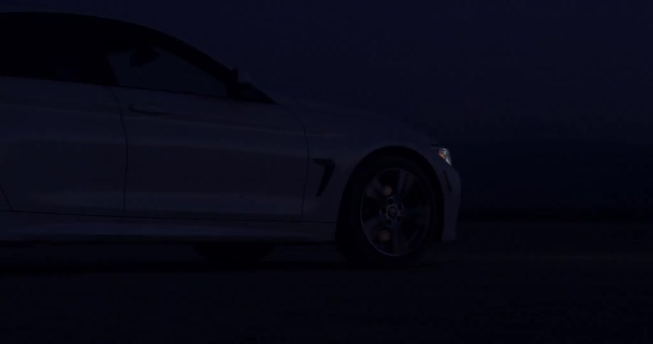 A vehicle travels through the darkness